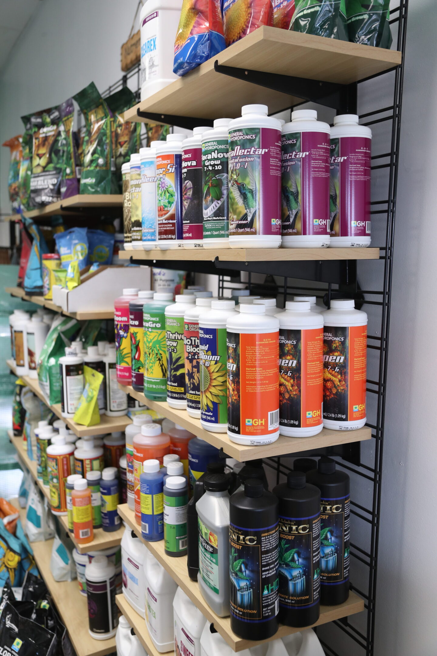 Gardening store shelves with nutrient bottles